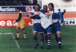 Marshall, Fotiadis and Alexander celebrate the former's goal that clinched a 2-0 home win