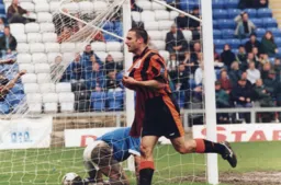 Andrew Fotiadis celebrates his winning goal in a 1-0 win but results elsewhere means Luton are condemned to the play-offs