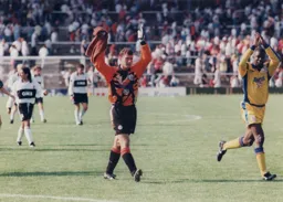 Kelvin Davis and Marvin Johnson thank the Town faithful at the final whistle