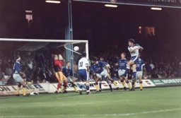 Tim Carter saves this effort by Steve Davis