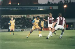 Dwight Marshall is closed down by Roy Hunter and David Brightwell