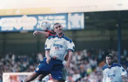 Simon Davies gets his head on the ball