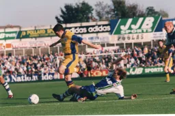 Tony Thorpe avoids a sliding tackle