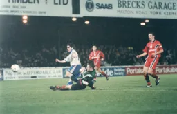 Tony Thorpe knocks the ball past Andy Warrington to score Town`s second goal