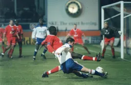 Graham Alexander is at full stretch as he attempts to cross the ball