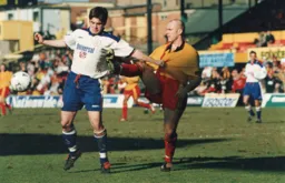 Tony Thorpe holds off a challenge by Robert Page