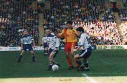 Graham Alexander looks to pass to Tony Thorpe