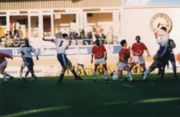 Steve Davis shoots through a crowded penalty area.