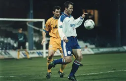 Phil Gray shields the ball from his marker