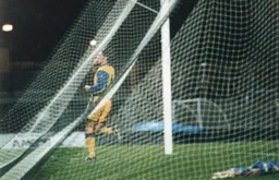 Rory Allen salutes the travelling Town fans after scoring the only goal of the game