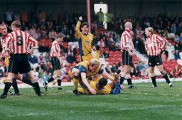 Dwight Marshall is on the ground after scoring Town`s first goal