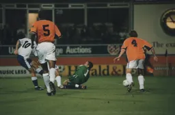 Andrew Fotiadis slots home the first goal for Luton