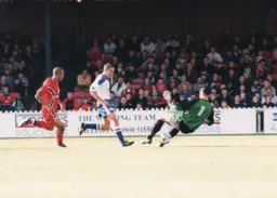 Sean Evers scores after slotting the ball between the keepers legs