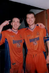 Goal scorers Phil Gray and Steve Davis celebrate after the game
