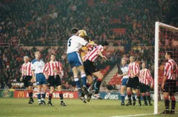 Steve Davis goes up for the ball