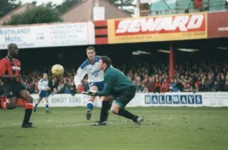 Andrew Fotiadis watches on as Mark Ovendale prepares to catch the ball