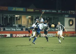 Stuart Douglas takes a battering from the County defender