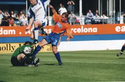 Phil Gray goes for the loose ball