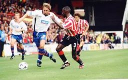 Adam Locke makes his Luton league debut in a 2-0 defeat at Griffin Park