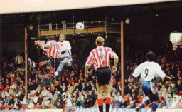 Tresor Kandol hurdles the barrier put up by the Bees defence