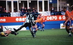 Tony Thorpe, partially hidden, finishes in his usual emphatic style