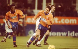 Michael McIndoe spins away from the Cambridge midfield