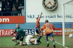 Matty Taylor celebrates his winner with the Kenilworth Road end