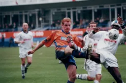 Striker Gary Doherty beats Efe Sodje who had been his defensive partner earlier in the season