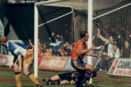 Gray begins his celebration with the Kenilworth Road enders