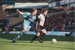 Phil Gray shields the ball and gives the Wanderers a lesson in game management