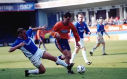 Matty Spring gets ahead of the Latics which matched the final league table as the Town finished 13th with Oldham 14th