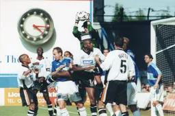Darren Ward scoops the ball off the head of Emmerson Boyce