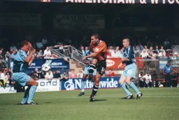 Andrew Fotiadis takes a shot at goal but Jamie Bates gets in the way