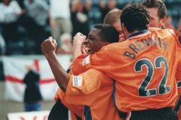 Tresor Kandol is mobbed by his team mates after scoring Town`s goal