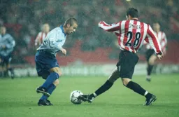 Stuart Fraser moves in to tackle John Oster