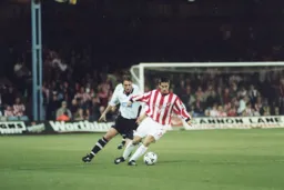 Adam Locke closes his man down