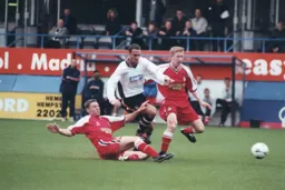 It takes a sliding tackle to prevent Andrew Fotiadis from getting through