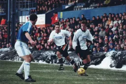 Peter Holmes on the ball as Andrew Fotiadis moves inside