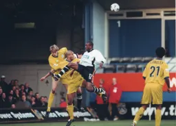 Emmerson Boyce rises highest but the ball is cleared