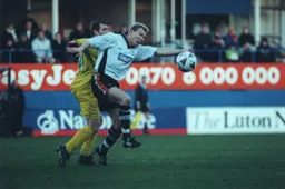 Petri Helin takes a shove in the back