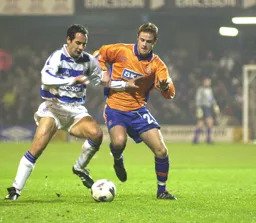 Peter Holmes battles for the ball
