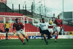 Mark Stein looks to control the ball