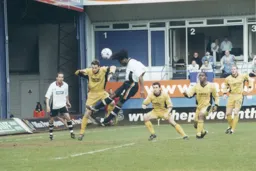 Stuart Douglas wins a header in the six yard area
