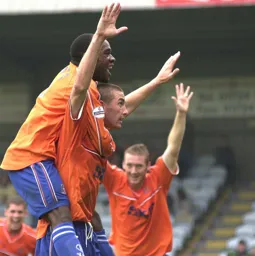 Russell Perrett is congratulated after netting the Town's second goal