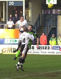 Matthew Taylor rises highest to head in the Town's second goal