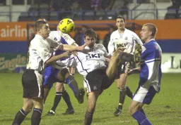 Russell Perrett clears the ball