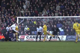 Steve Howard scores his second off his knee