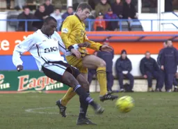 Emmerson Boyce plays the ball forward