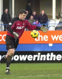 Carl Emberson powers the ball upfield