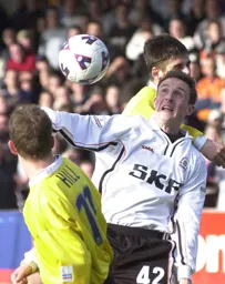 Gary McSwegan is caught between two Torquay defenders